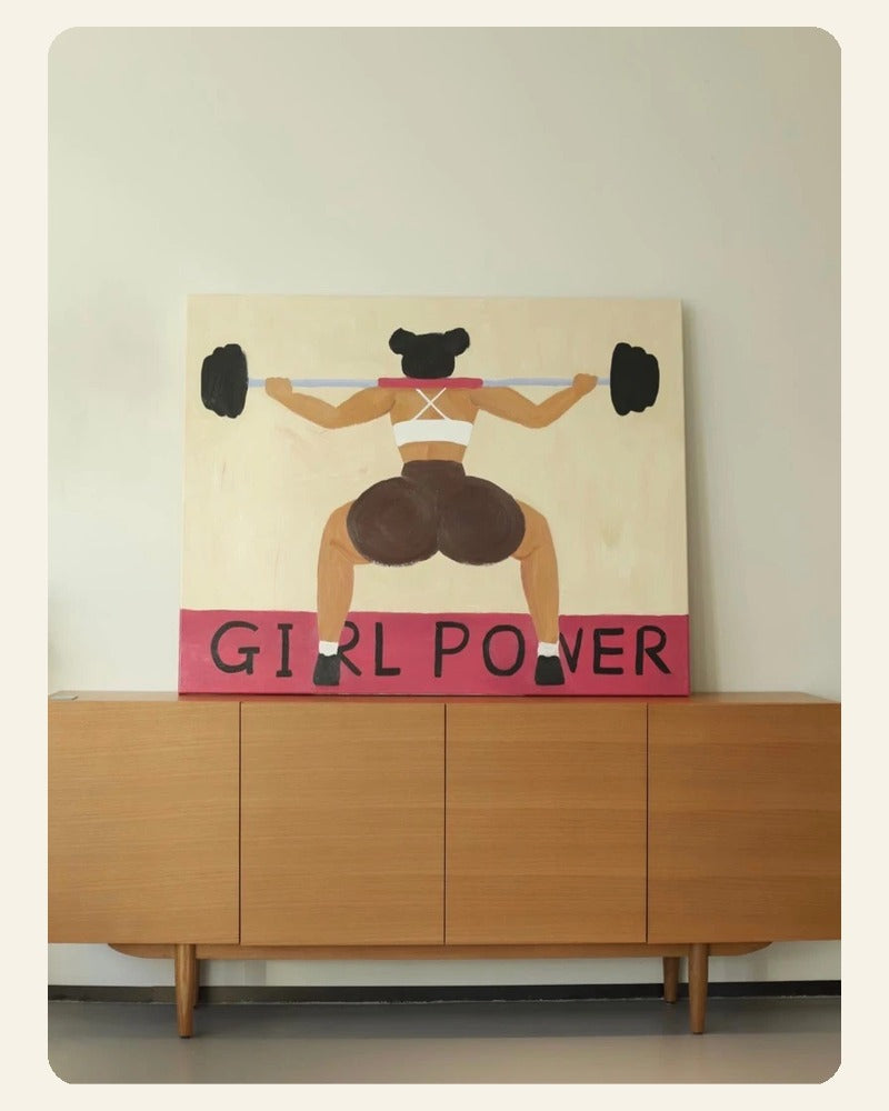 Girl Power art print showing a woman lifting a barbell above a bright pink title block.